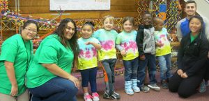 volunteers and children on a field trip